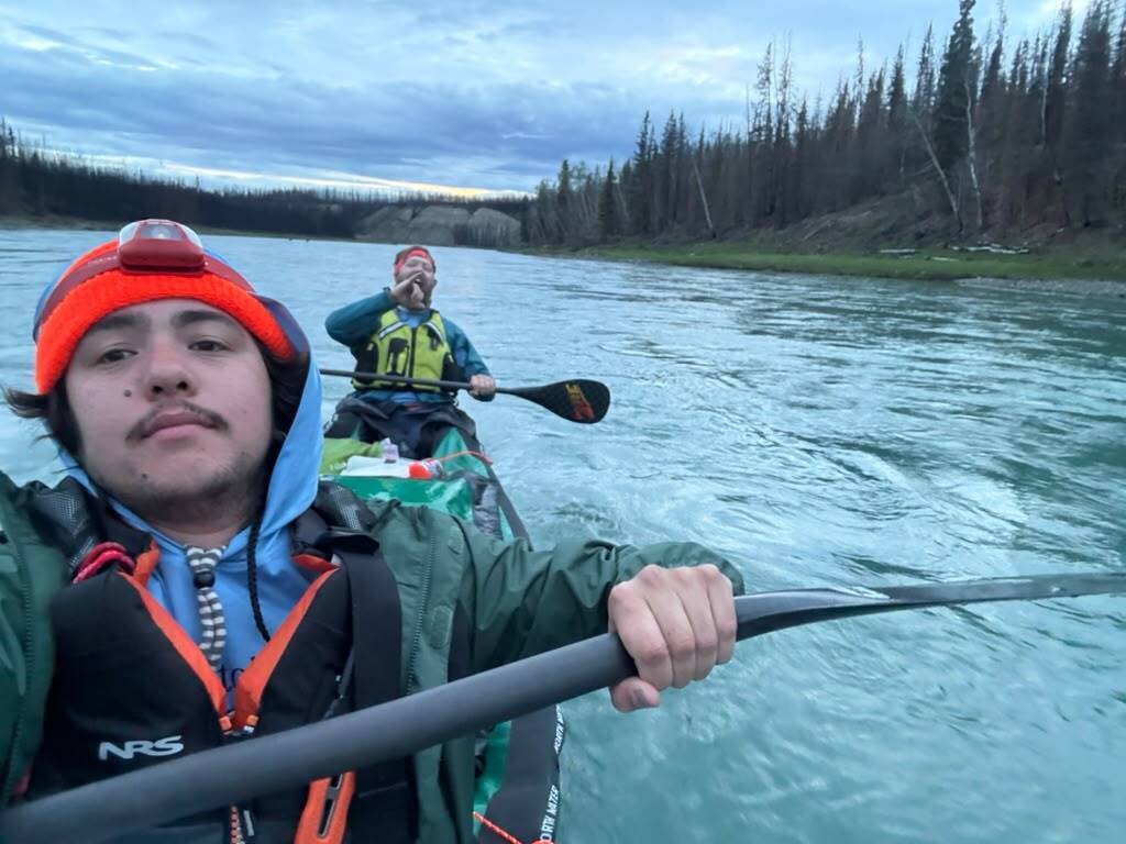 Christian Nunez (foreground) and Jonathan Hillis work the current in a tandem canoe dubbed “Bourcy’s Behind Us” during the first